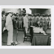 General Yoshijiro Umezu signing at surrender ceremonies aboard Battleship Missouri in Tokyo Bay (ddr-densho-1007-88)