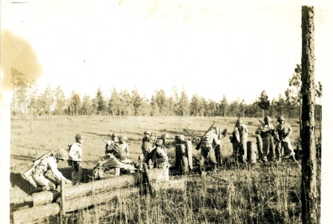Soldiers working in a field (ddr-densho-22-213)