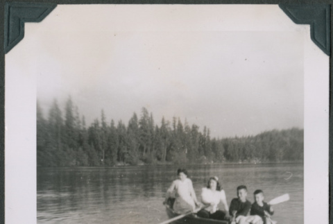 Photo of four people in a row boat (ddr-densho-483-1253)