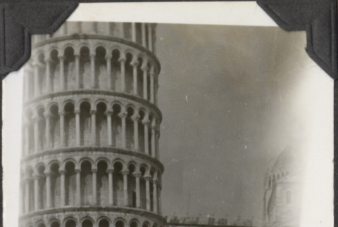 Man standing in front of Leaning Tower of Pisa (ddr-densho-466-678)
