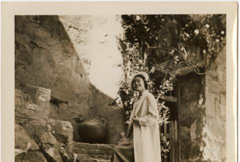 Tomoye (Nozawa) Takahashi standing on stone steps (ddr-densho-426-1787)