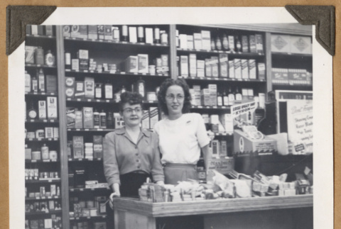 Two women behind a counter (ddr-densho-542-97)