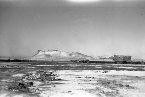 Ward 4 & 7 in the snow, Castle Rock in the background (ddr-densho-570-38)