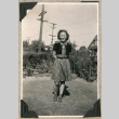 Girl standing in yard (ddr-densho-383-148)