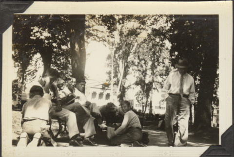 Group at park getting their shoes shines (ddr-densho-326-583)