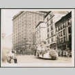Parade float passing the Gowman Hotel in Seattle (ddr-densho-483-556)