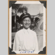 Boy smiling by a car (ddr-densho-542-208)