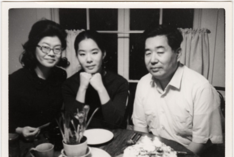 Tomoye, Masako and Henri Takahashi seated at a table (ddr-densho-426-94)