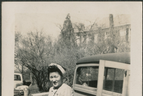 Woman standing next to truck (ddr-densho-316-425)