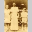 Young woman posing with a girl and boy (ddr-njpa-4-2467)