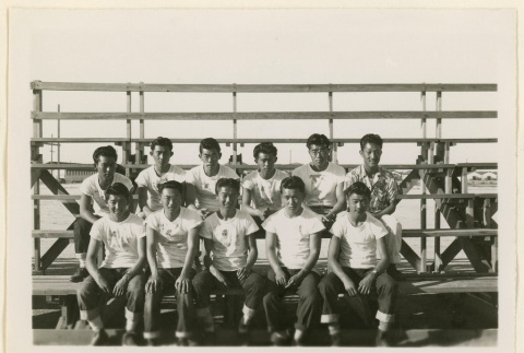 Basketball team seated on bleachers (ddr-densho-37-1024)