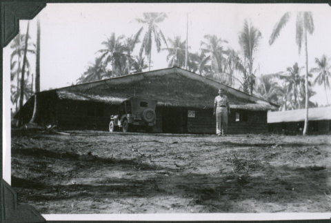 Man standing outside building (ddr-ajah-2-653)