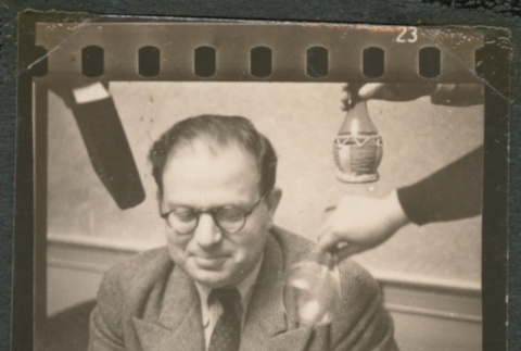 Man surrounded by various objects (ddr-densho-433-779)