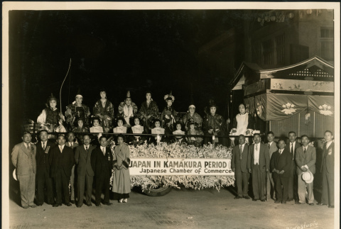 Members of the Japanese Chamber of Commerce pose with a parade float (ddr-densho-395-109)