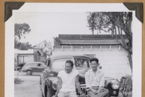 Gary Kikawa and a man on a car bumper (ddr-densho-542-78)