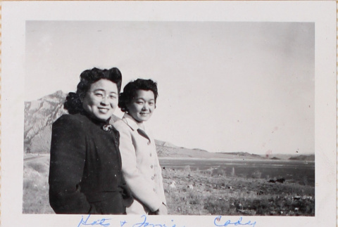 Two women standing outside with hill in background (ddr-densho-464-105)