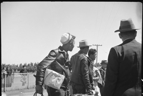 Japanese Americans arriving at Tanforan (ddr-densho-151-162)