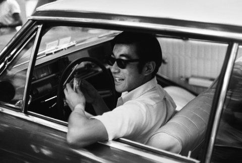 Joel Suzuki in a car (ddr-densho-336-144)