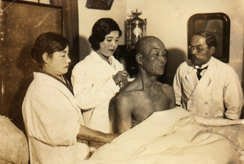 Man receiving medical treatment (ddr-njpa-4-342)