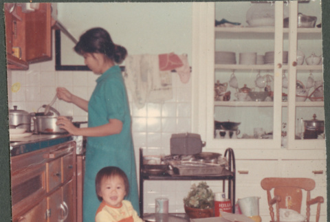 Woman and child in kitchen (ddr-densho-523-504)