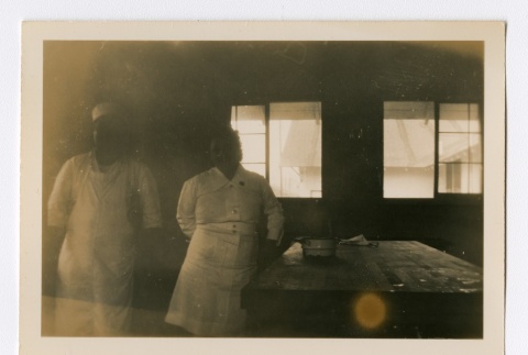 Man and nurse next to a prep table (ddr-densho-223-37)