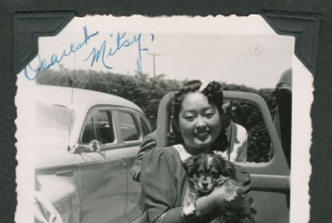 Sumiko Yanaginuma holding puppy (ddr-densho-550-229)