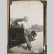 Mits poses with a car (ddr-densho-542-54)