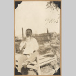 Man with a baby (ddr-densho-542-166)