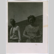 Man and woman by building (ddr-densho-329-739)