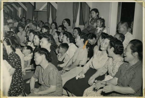A crowd laughing during a play (ddr-manz-4-136)