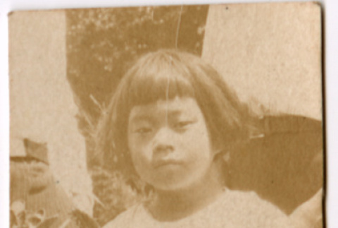 Girl standing in garden (ddr-densho-426-1475)