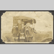 Three children next to car (ddr-densho-326-376)