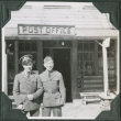 Two men standing outside post office.  Joe Iwataki on right (ddr-ajah-2-351)