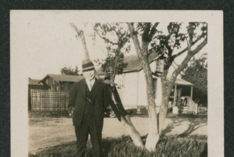 man next to tree (ddr-densho-378-804)