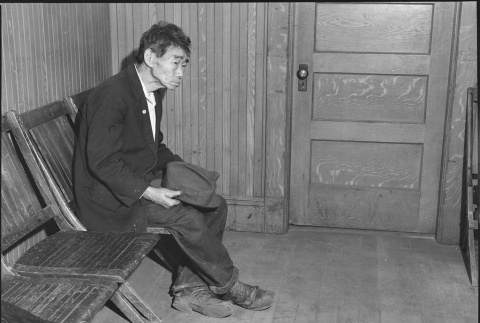 Issei man waiting to register for mass removal (ddr-densho-151-238)