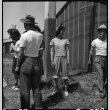 Japanese Americans outside barracks (ddr-densho-151-252)