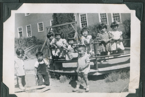 Photo of nine children on a playground (ddr-densho-483-897)