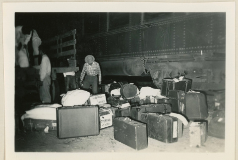 Unloading baggage at Casa Grande train station (ddr-densho-37-893)