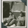 Two soldiers leaning against a tent (ddr-densho-201-538)