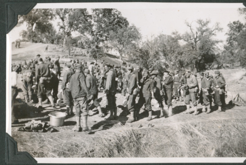 Group of men waiting in line (ddr-ajah-2-185)