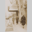 People walking on sidewalk (ddr-janm-17-49)