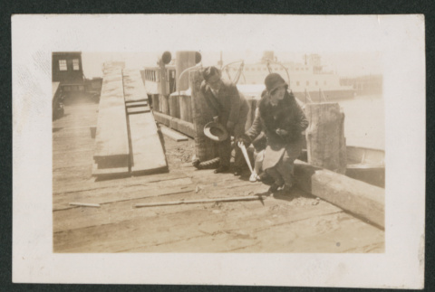 man and woman standing up on a deck (ddr-densho-378-775)