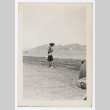 Woman stands on a shore (ddr-densho-404-426)