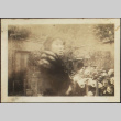 Woman in fur wrap standing in garden (ddr-densho-423-533)