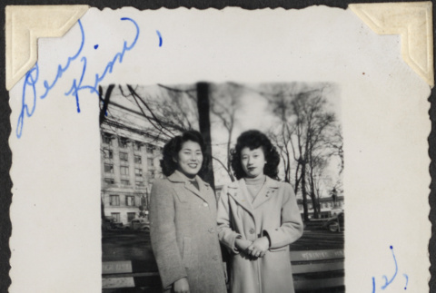 Two women standing by park bench (ddr-densho-466-894)