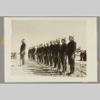 Men standing in a line outdoors (ddr-njpa-13-1537)