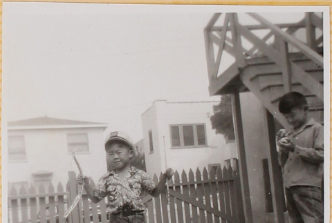 William Shiomi with bow and arrow (ddr-densho-522-284)