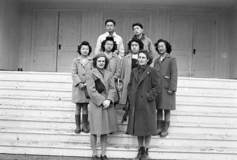 Class photo on the steps of an auditorium (ddr-fom-1-483)