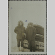 Two men with a car stuck in the snow (ddr-densho-321-1247)