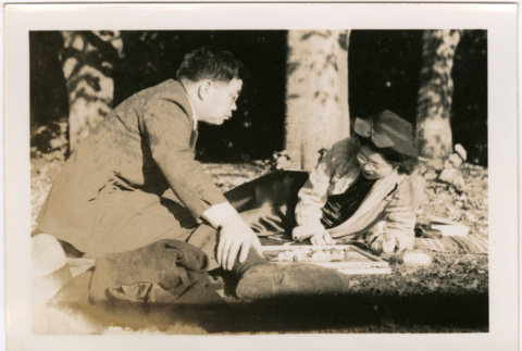 Tomoye (Nozawa) Takahashi and Tomoyuki Nozawa playing Chinese Checkers (ddr-densho-426-1716)